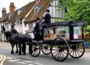 The hearse setting off