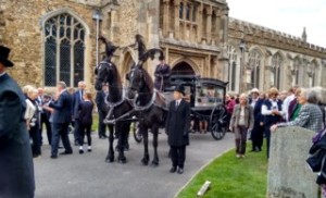 The hearse in the church yard