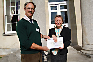 Sue Flood accepts our cheque from David Howlett